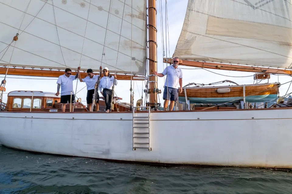 Crew on the deck of So Fong under sail