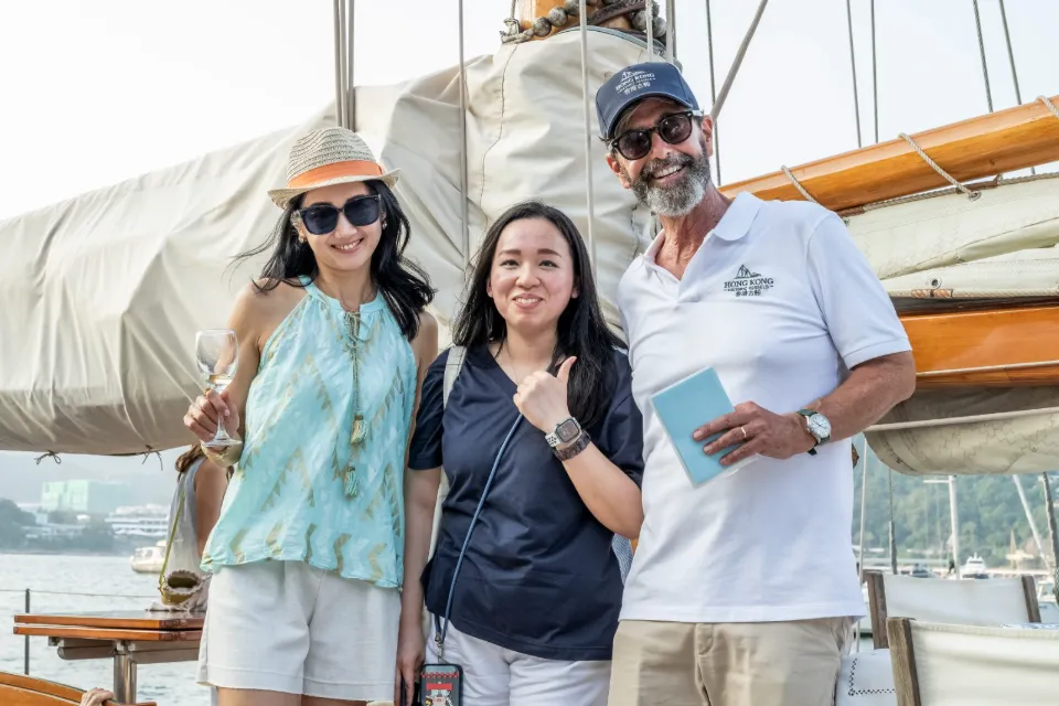 Three guests on the deck of So Fong