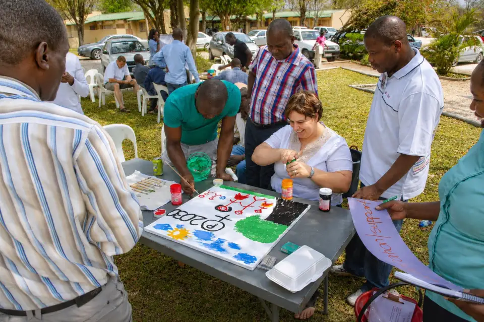 Participants painting together at a table