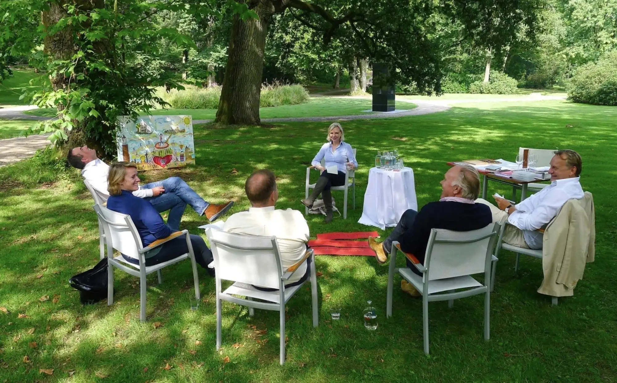 Participants in dialogue in a garden